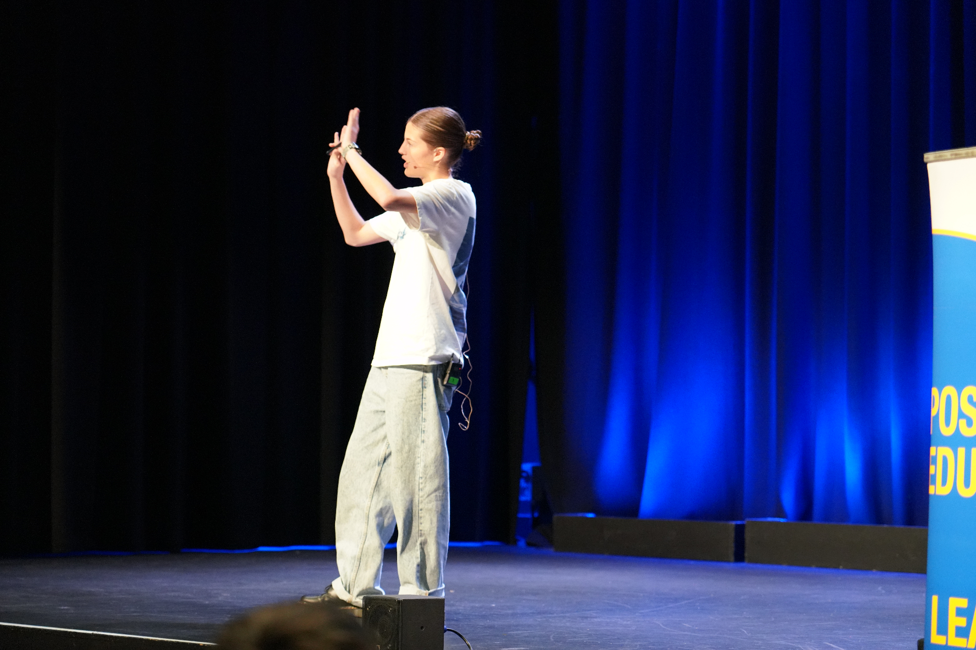 Amity Fielding speaking on stage